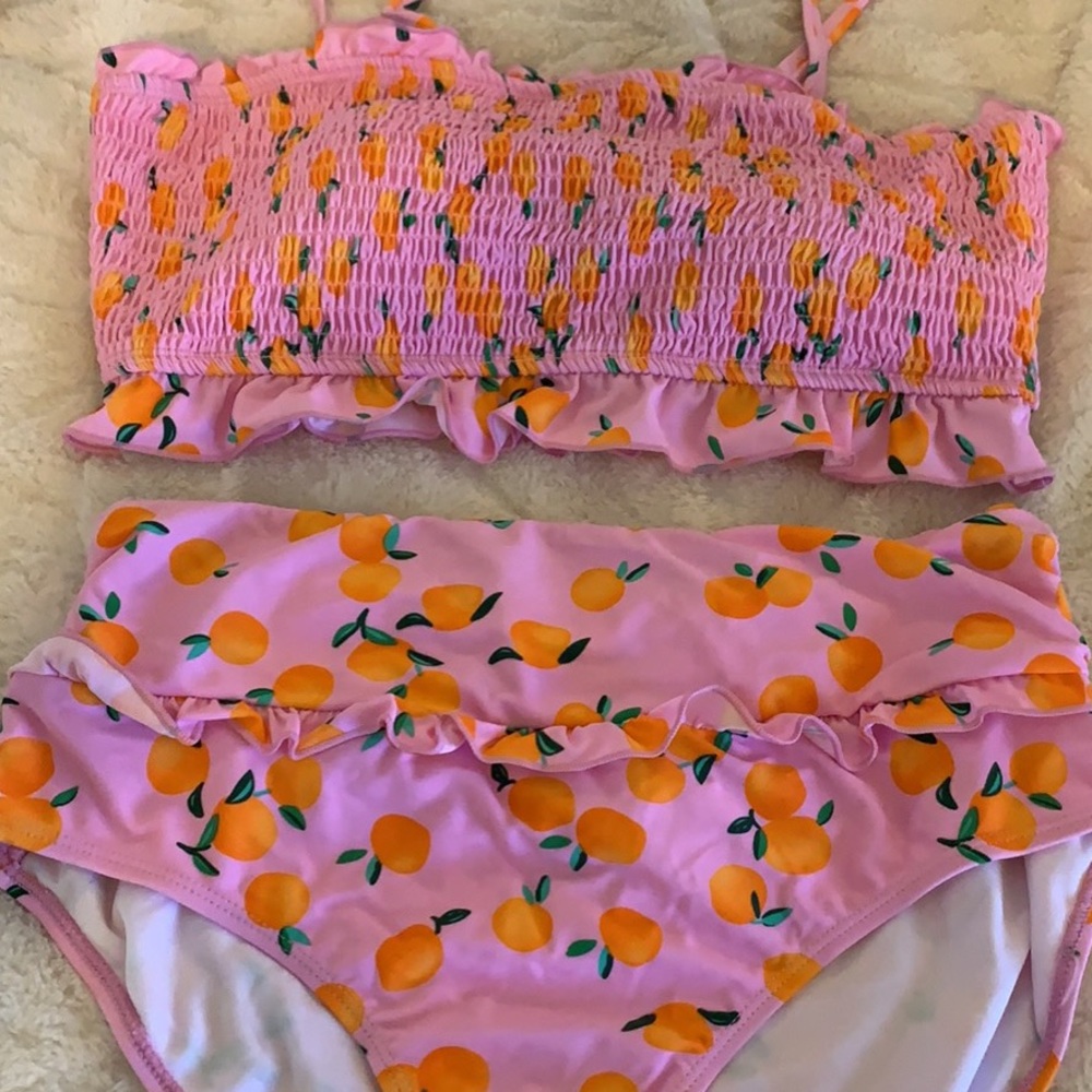 Pink bathing suite with oranges!